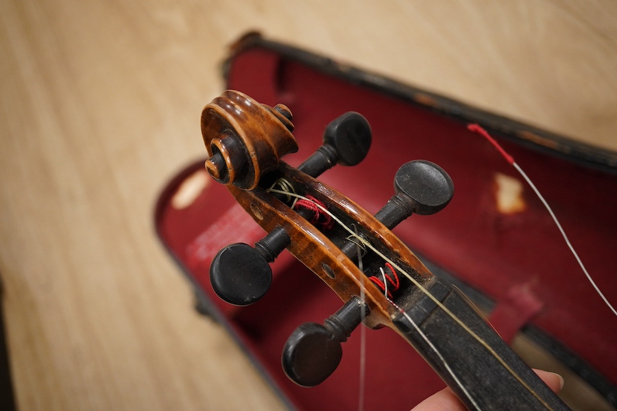 Two cased violins; one French 19th century bearing a hand written label for Francesco Werentle 1746, body length 35.5cm, the other an early 20th century violin, body length 35cm. Condition - poor.